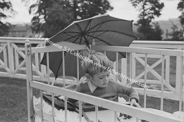 LOURDES HOSPITAL CHILD WITH PARASOL  PADDY GARVEY  20 ST MARYS TERRACE